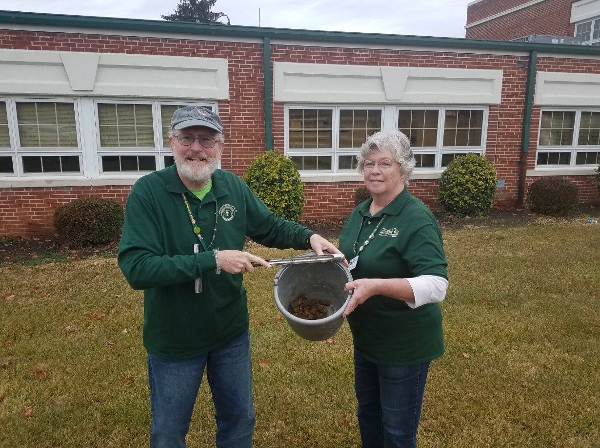 Master Gardeners Rich Howell and Sharon Rodriguez show a composite soil sample ready to be placed in a soil box for shipment